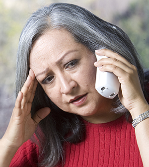 Woman talking on phone.