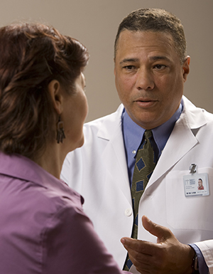 Woman talking to healthcare provider.